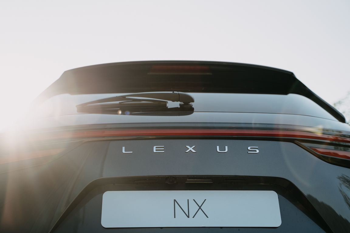 Backside of Lexus NX in beautiful morning light with light leaks.